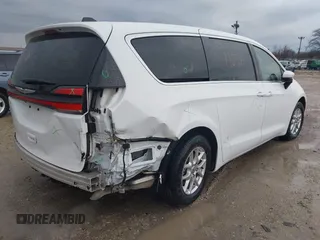 2023 Chrysler Pacifica Touring L with VIN 2C4RC1BG6PR520945, listed as a IAAI auction lot 41591128 with 70,351 mi miles and . Bid and sale history available at DreamBid. Image 4.