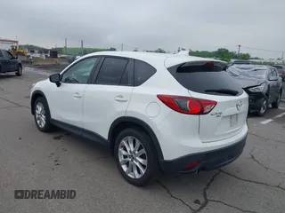 2015 Mazda CX-5 Grand Touring with VIN JM3KE4DY5F0530854, listed as a IAAI auction lot 42274582 with 144,732 mi miles and . Bid and sale history available at DreamBid. Image 3.