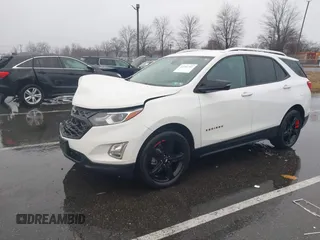 2021 Chevrolet Equinox Premier z VIN 2GNAXNEV7M6112087, wystawiony jako IAAI lot #41102702 z przebiegiem 32 995 mil mil oraz . Historia ofert i sprzedaży dostępna na DreamBid. Obrazek 2.