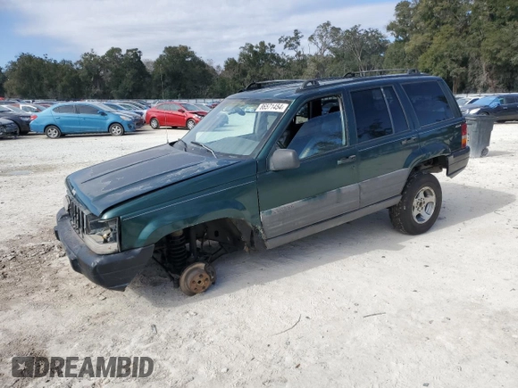 1996 Jeep Grand Cherokee Laredo with VIN 1J4GZ58S1TC340018, listed as a Copart auction lot 86571454 with 0 mi miles and Salvage Title. Bid and sale history available at carsss.com. Image 1.