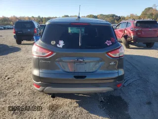 2016 Ford Escape SE with VIN 1FMCU9GX0GUB86582, listed as a Copart auction lot 74035344 with 115,538 mi miles and Salvage Title. Bid and sale history available at DreamBid. Image 6.