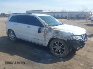 2015 Jeep Grand Cherokee Summit with VIN 1C4RJFJGXFC734025, listed as a IAAI auction lot 41842927 with 137,993 mi miles. Bid and sale history available at carsss.com. Image 1.