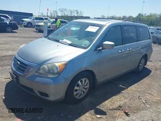 2010 Honda Odyssey EX-L with VIN 5FNRL3H62AB001954, listed as a IAAI auction lot 42028959 with 142,743 mi miles. Bid and sale history available at carsss.com. Image 2.
