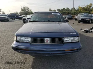 1994 Oldsmobile Cutlass Ciera S z VIN 1G3AG55M3R6436697, wystawiony jako Copart lot #79562944 z przebiegiem 118 629 mil mil oraz Szkody całkowita. Historia ofert i sprzedaży dostępna na DreamBid. Obrazek 5.