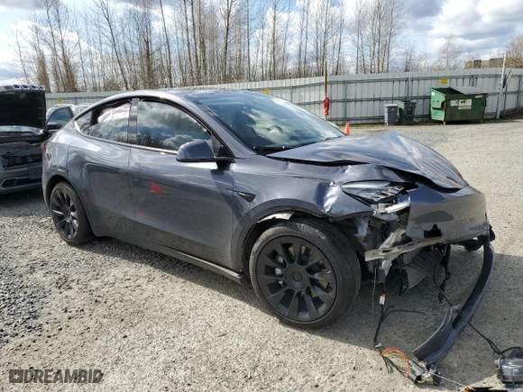 2022 Tesla Model Y Long Range with VIN 7SAYGAEE9NF517298, listed as a Copart auction lot 49450055 with 0 mi miles and Salvage Title. Bid and sale history available at carsss.com. Image 4.