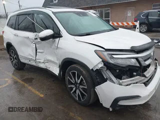 2021 Honda Pilot Touring 8-Passenger z VIN 5FNYF6H90MB031795, wystawiony jako IAAI lot #41207263 z przebiegiem 56 367 mil mil oraz . Historia ofert i sprzedaży dostępna na DreamBid. Obrazek 1.