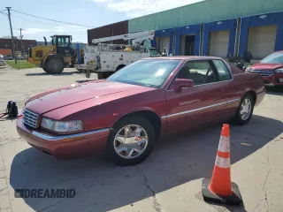 1997 Cadillac Eldorado ESC z VIN 1G6EL12Y5VU614955, wystawiony jako Copart lot #56222345 z przebiegiem 62 030 mil mil oraz Tytuł czysty. Historia ofert i sprzedaży dostępna na DreamBid. Obrazek 1.