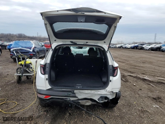 2022 Hyundai Tucson Hybrid Blue with VIN KM8JBCA10NU029999, listed as a Copart auction lot 46636175 with 53,257 mi miles and Salvage Title. Bid and sale history available at carsss.com. Image 6.