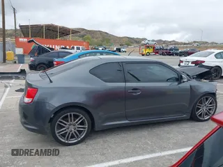 2013 Scion tC with VIN JTKJF5C74D3052964, listed as a IAAI auction lot 41804627 with 244,013 mi miles. Bid and sale history available at carsss.com. Image 13.