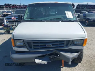 2006 Ford Econoline Cargo with VIN 1FTRE14W06HA83095, listed as a IAAI auction lot 42329493 with 189,119 mi miles and . Bid and sale history available at DreamBid. Image 12.