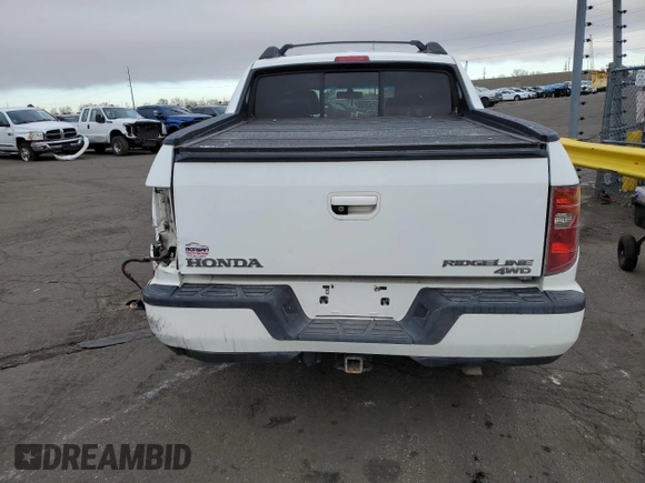 2010 Honda Ridgeline RTL with VIN 5FPYK1F58AB005088, listed as a Copart auction lot 47477975 with 128,538 mi miles and Salvage Title. Bid and sale history available at carsss.com. Image 6.