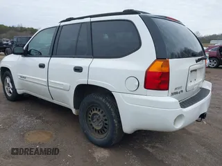 2004 GMC Envoy SLE with VIN 1GKDT13SX42357048, listed as a IAAI auction lot 41601126 with 304,101 mi miles. Bid and sale history available at carsss.com. Image 3.