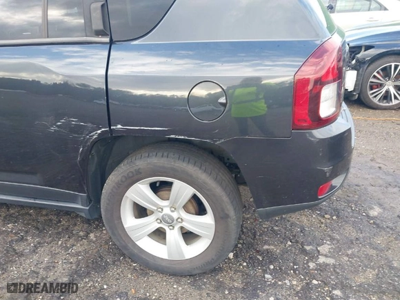 2014 Jeep Compass Latitude with VIN 1C4NJCEB2ED859539, listed as a IAAI auction lot 41809569 with 192,384 mi miles. Bid and sale history available at carsss.com. Image 12.