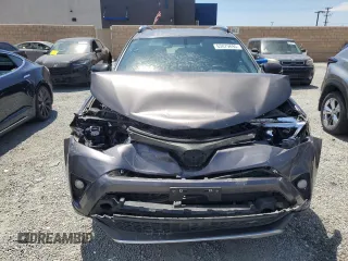 2016 Toyota RAV4 SE with VIN JTMNFREV2GJ072643, listed as a Copart auction lot 63879695 with 104,118 mi miles and Salvage title. Bid and sale history available at DreamBid. Image 5.