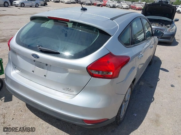 2016 Ford Focus SE with VIN 1FADP3K29GL269691, listed as a IAAI auction lot 42061051 with 100,692 mi miles. Bid and sale history available at carsss.com. Image 4.
