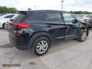 2019 Hyundai Tucson SE with VIN KM8J23A40KU874423, listed as a IAAI auction lot 41858253 with 136,651 mi miles. Bid and sale history available at carsss.com. Image 4.