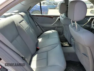 2002 Mercedes-Benz E-Class with VIN WDBJF82J92X065591, listed as a Copart auction lot 65841964 with 155,195 mi miles and Salvage Title. Bid and sale history available at carsss.com. Image 10.