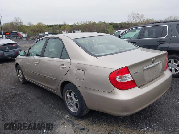 2004 Toyota Camry LE with VIN 4T1BE30KX4U327013, listed as a IAAI auction lot 41987105 with 241,236 mi miles. Bid and sale history available at carsss.com. Image 3.