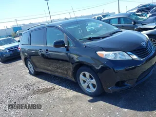 2014 Toyota Sienna LE AAS with VIN 5TDKK3DC4ES445998, listed as a IAAI auction lot 42093872 with 220,943 mi miles. Bid and sale history available at carsss.com. Image 1.