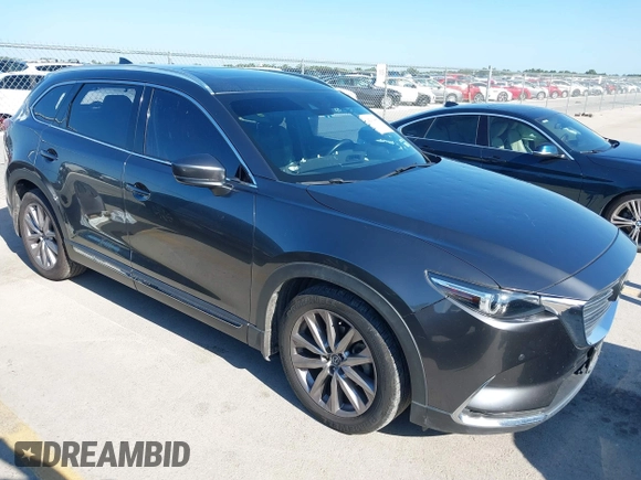 2020 Mazda CX-9 Grand Touring with VIN JM3TCADY1L0417651, listed as a IAAI auction lot 42334867 with 105,236 mi miles and . Bid and sale history available at DreamBid. Image 1.