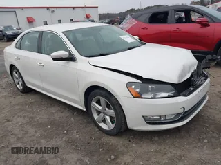 2015 Volkswagen Passat 1.8T Wolfsburg Ed with VIN 1VWAT7A33FC106914, listed as a IAAI auction lot 41211926 with 141,106 mi miles. Bid and sale history available at carsss.com. Image 1.