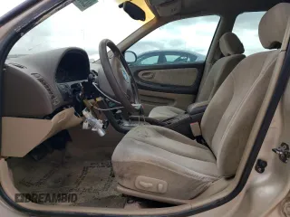 2001 Nissan Maxima SE z VIN JN1CA31D81T606081, wystawiony jako Copart lot #82989204 z przebiegiem 181 732 mil mil oraz Tytuł czysty. Historia ofert i sprzedaży dostępna na DreamBid. Obrazek 7.