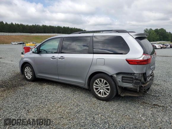 2016 Toyota Sienna XLE with VIN 5TDYK3DC8GS715148, listed as a Copart auction lot 57834045 with 128,769 mi miles and Salvage title. Bid and sale history available at DreamBid. Image 2.
