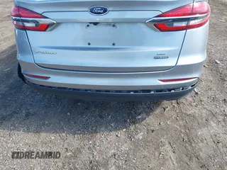 2020 Ford Fusion SE z VIN 3FA6P0LU8LR163896, wystawiony jako IAAI lot #41994803 z przebiegiem 89 892 mil mil oraz . Historia ofert i sprzedaży dostępna na DreamBid. Obrazek 19.