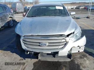 2013 Ford Taurus SEL with VIN 1FAHP2E83DG224780, listed as a IAAI auction lot 41675601 with 166,977 mi miles. Bid and sale history available at carsss.com. Image 12.
