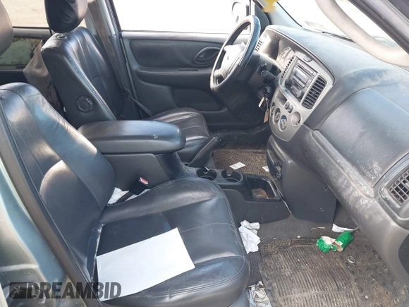 2003 Mazda Tribute ES with VIN 4F2CZ96133KM29066, listed as a IAAI auction lot 41581210 with 265,586 mi miles. Bid and sale history available at carsss.com. Image 5.
