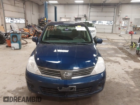 2009 Nissan Versa 1.8 S with VIN 3N1BC11E79L440560, listed as a IAAI auction lot 41975289 with 158,726 mi miles. Bid and sale history available at carsss.com. Image 13.