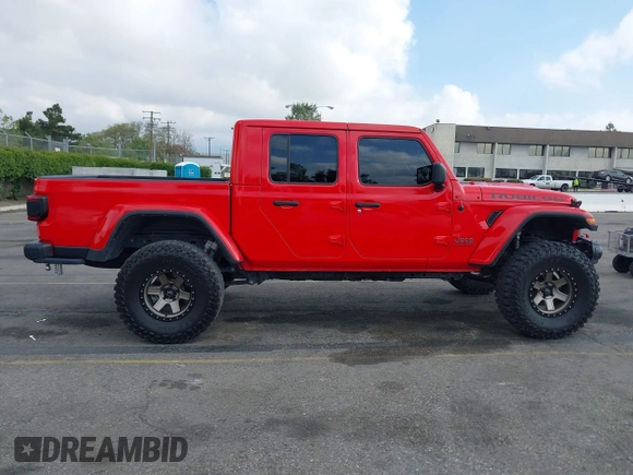 2021 Jeep Gladiator Rubicon with VIN 1C6JJTBGXML572976, listed as a IAAI auction lot 42134909 with 35,612 mi miles and . Bid and sale history available at DreamBid. Image 13.