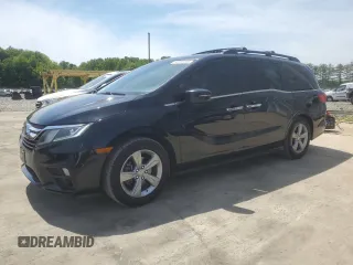 2018 Honda Odyssey EX-L z VIN 5FNRL6H79JB022861, wystawiony jako Copart lot #56889355 z przebiegiem 48 188 mil mil oraz Tytuł czysty. Historia ofert i sprzedaży dostępna na DreamBid. Obrazek 1.