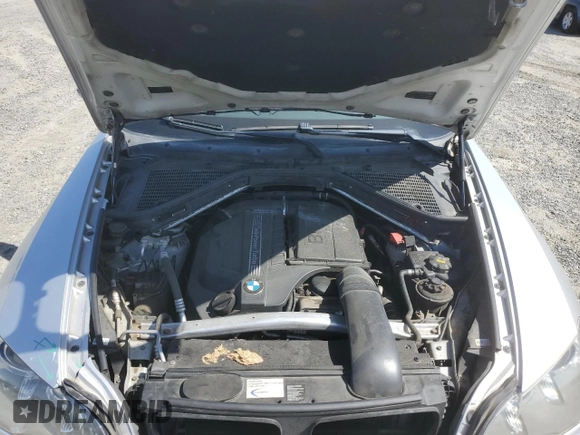 2012 BMW X5 35i with VIN 5UXZV4C5XCL751020, listed as a Copart auction lot 59327845 with 106,249 mi miles and Salvage title. Bid and sale history available at DreamBid. Image 12.