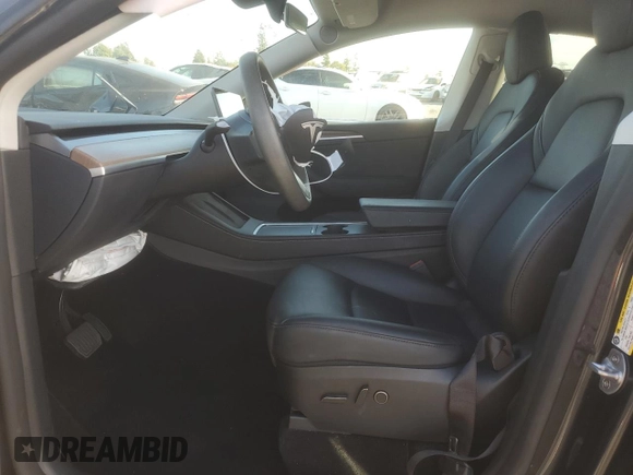 2024 Tesla Model Y with VIN 7SAYGDED7RF056973, listed as a Copart auction lot 87139214 with 15,391 mi miles and Salvage Title. Bid and sale history available at DreamBid. Image 7.