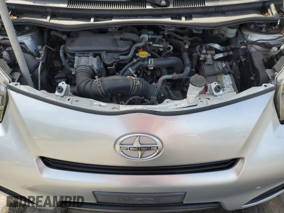 2013 Scion iQ z VIN JTNJJXB08DJ023545, wystawiony jako Copart lot #53999025 z przebiegiem 149 895 mil mil oraz Szkoda całkowita • Salvage title. Historia ofert i sprzedaży dostępna na DreamBid. Obrazek 11.