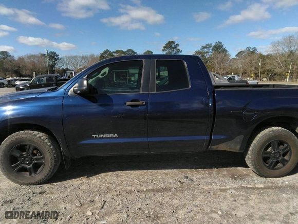 2012 Toyota Tundra 2WD Truck with VIN 5TFRM5F11CX041032, listed as a IAAI auction lot 41744471 with 207,330 mi miles. Bid and sale history available at carsss.com. Image 14.