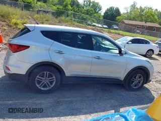 2018 Hyundai Santa Fe 2.4L z VIN 5XYZTDLB1JG546708, wystawiony jako IAAI lot #42399917 z przebiegiem 131 932 mil mil oraz . Historia ofert i sprzedaży dostępna na DreamBid. Obrazek 13.