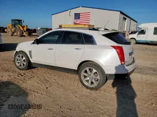 2016 Cadillac SRX Performance Collection with VIN 3GYFNCE37GS573748, listed as a Copart auction lot 66300135 with 136,619 mi miles and Salvage title. Bid and sale history available at DreamBid. Image 2.