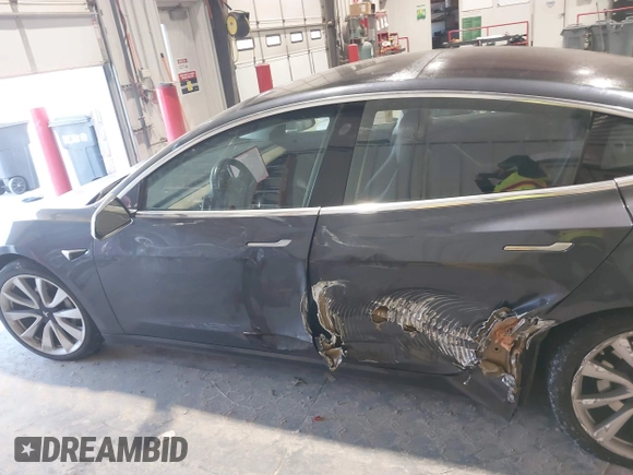 2018 Tesla Model 3 Long Range Battery with VIN 5YJ3E1EB1JF145520, listed as a IAAI auction lot 41360939 with 95,010 mi miles and . Bid and sale history available at DreamBid. Image 14.