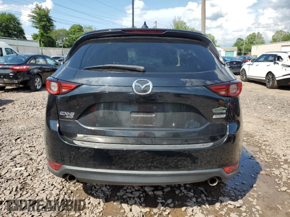 2018 Mazda CX-5 Grand Touring with VIN JM3KFBDM6J0345848, listed as a Copart auction lot 61587865 with 107,193 mi miles and Salvage title. Bid and sale history available at DreamBid. Image 6.