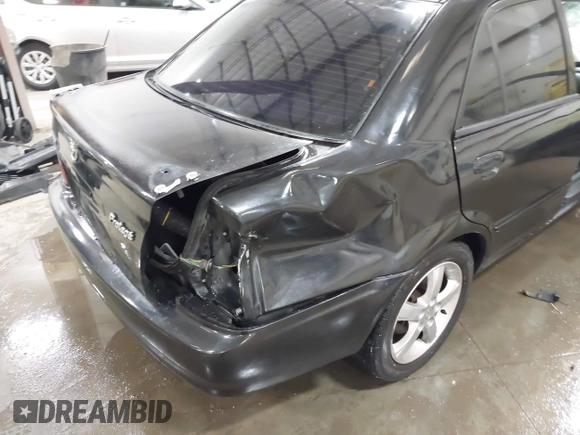 2003 Mazda Protege DX with VIN JM1BJ226431112902, listed as a IAAI auction lot 41939907 with 184,618 mi miles and . Bid and sale history available at DreamBid. Image 19.