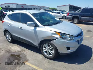 2013 Hyundai Tucson GLS with VIN KM8JU3AC3DU551018, listed as a IAAI auction lot 41988305 with 214,728 mi miles. Bid and sale history available at carsss.com. Image 1.