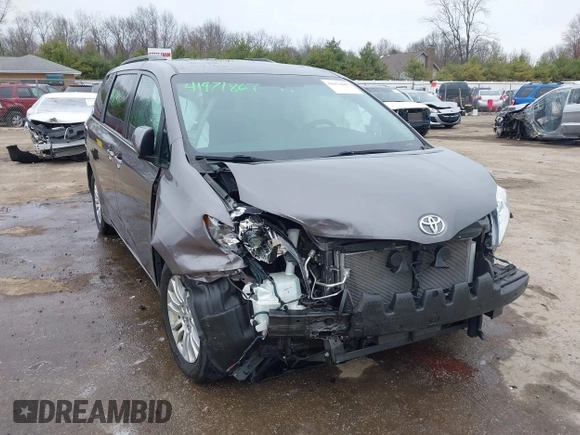 2015 Toyota Sienna XLE with VIN 5TDYK3DC8FS651580, listed as a IAAI auction lot 41971867 with 49,711 mi miles. Bid and sale history available at carsss.com. Image 1.