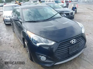 2013 Hyundai Veloster Turbo z VIN KMHTC6AE7DU142860, wystawiony jako IAAI lot #42132537 z przebiegiem 125 480 mil mil oraz . Historia ofert i sprzedaży dostępna na DreamBid. Obrazek 1.