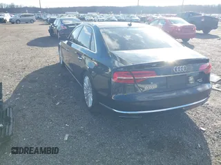 2015 Audi A8 L 4.0T with VIN WAU32AFD4FN014063, listed as a IAAI auction lot 41501970 with 158,570 mi miles. Bid and sale history available at carsss.com. Image 3.