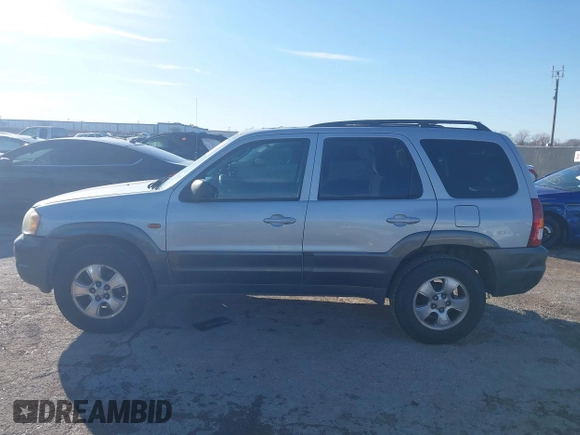 2003 Mazda Tribute LX with VIN 4F2YZ04183KM44733, listed as a IAAI auction lot 41472662 with 246,522 mi miles and . Bid and sale history available at DreamBid. Image 14.