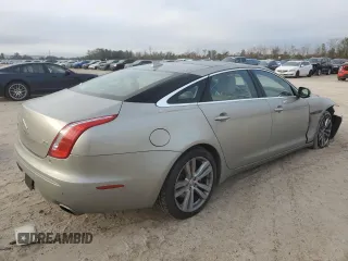 2014 Jaguar XJ with VIN SAJWA2GZ8E8V60138, listed as a Copart auction lot 86384064 with 137,190 mi miles and Salvage Title. Bid and sale history available at carsss.com. Image 3.
