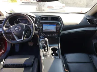 2016 Nissan Maxima Platinum z VIN 1N4AA6AP1GC416590, wystawiony jako IAAI lot #41817288 z przebiegiem 248 514 mil mil oraz . Historia ofert i sprzedaży dostępna na DreamBid. Obrazek 19.