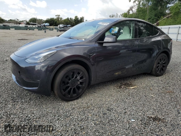 2024 Tesla Model Y Long Range with VIN 7SAYGDEE4RA285620, listed as a Copart auction lot 57883015 with 18,841 mi miles and Salvage title. Bid and sale history available at DreamBid. Image 1.